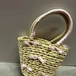 Elegant Straw Tote with Pink Bow Accents